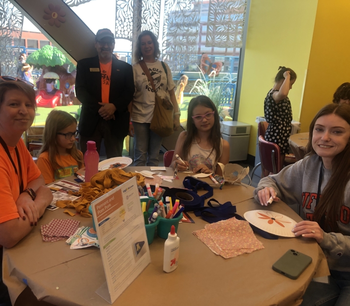 A group of Buffalo State representatives with students at Explore & More